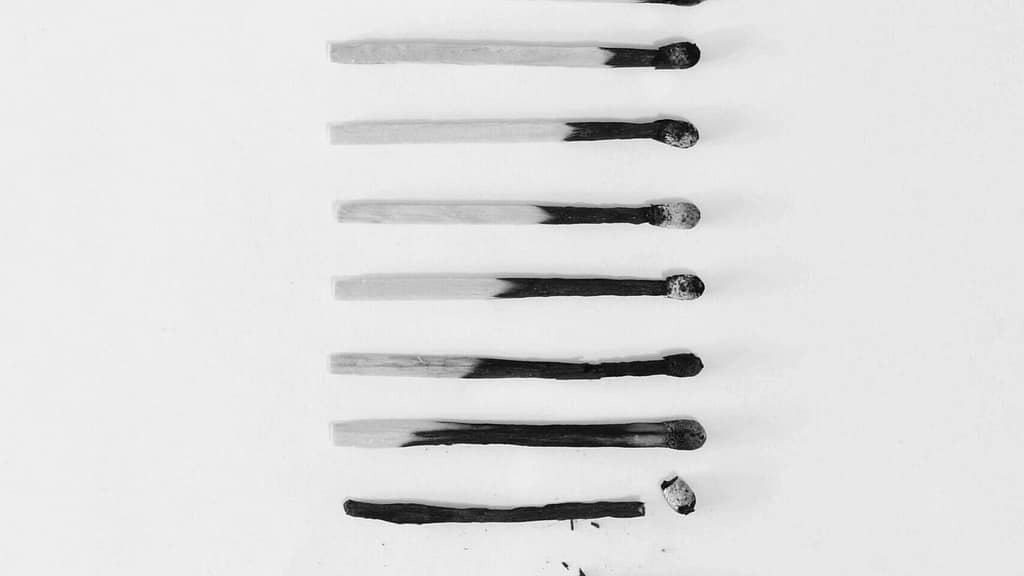 A black and white image of a column of matches increasingly burnt. Decision fatigue can look a lot like burnout.