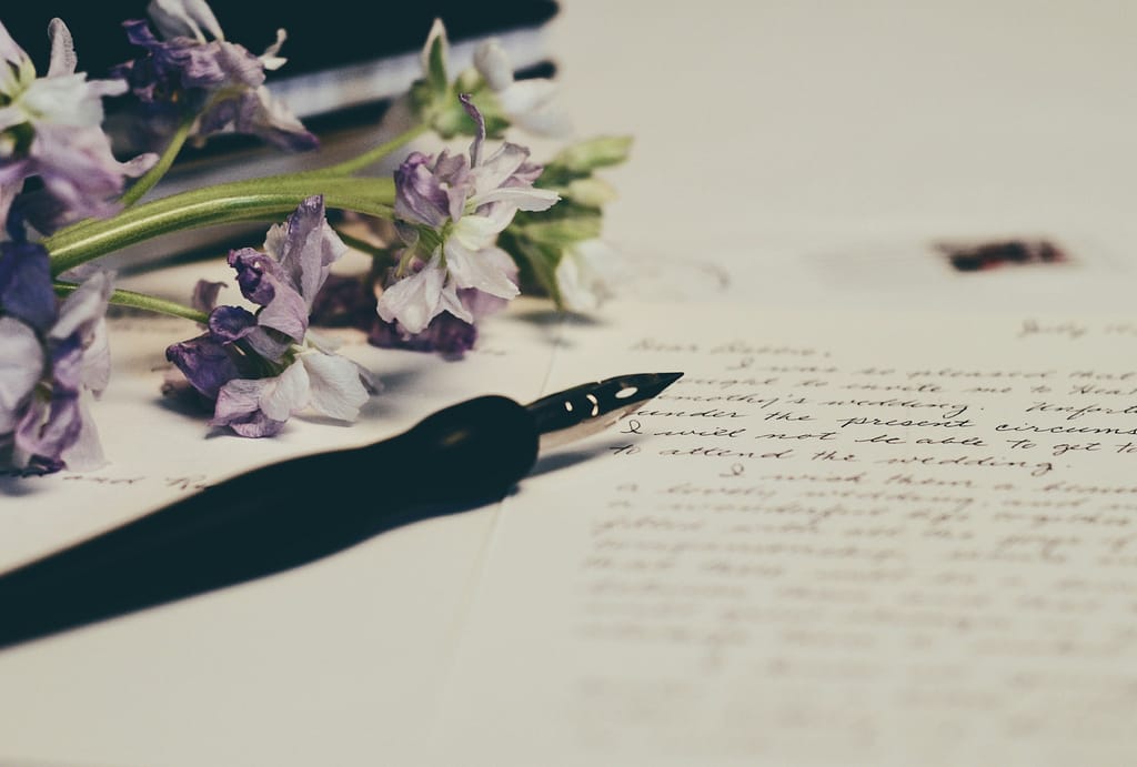 Looking back: A letter to my younger self about life and lessons learned. A fountain pen, some flowers and a letter.