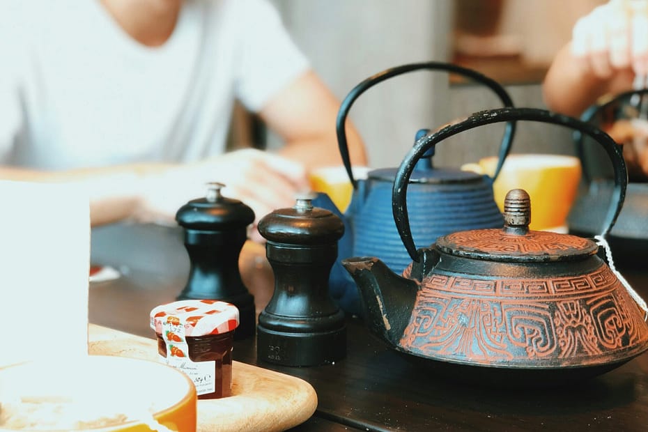 Friends sit together for a cup of tea