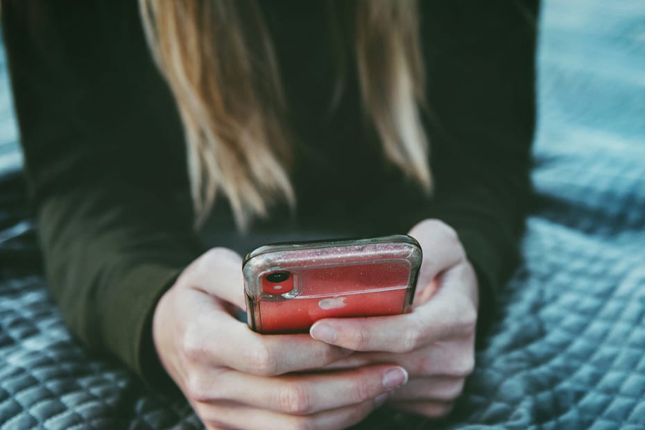 A woman on an iPhone.