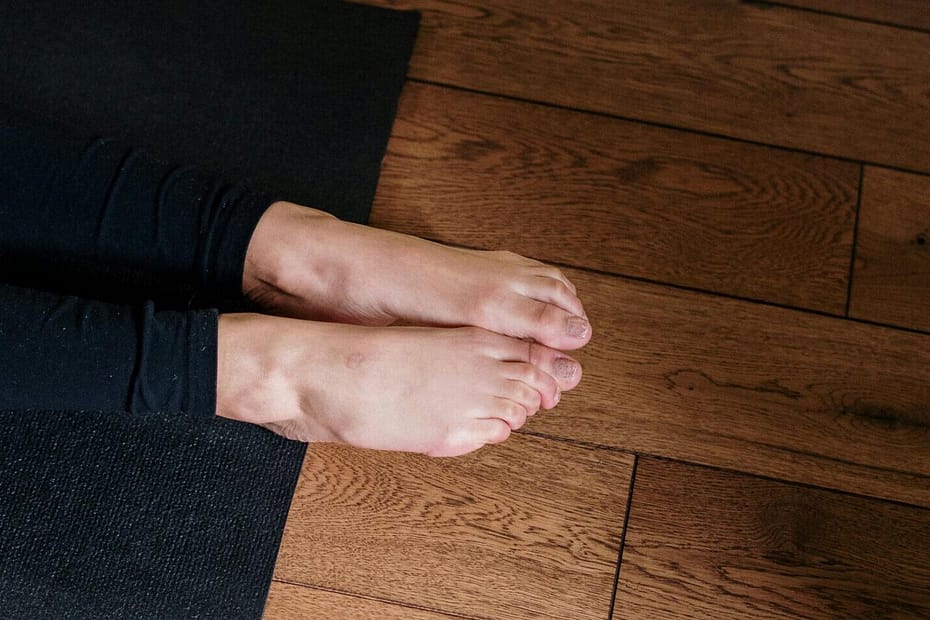 Feet hanging off the end of a yoga mat. These are not my feet because they didn't hang off the end of a yoga mat this morning. Sigh.