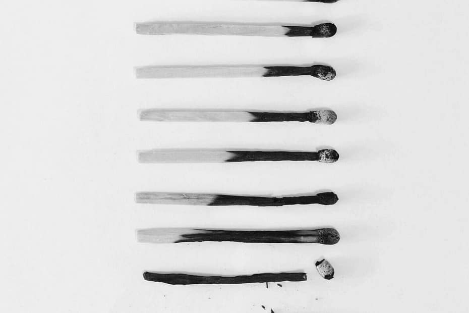 A black and white image of a column of matches increasingly burnt. Decision fatigue can look a lot like burnout.